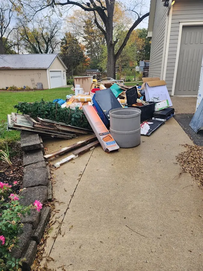 Dumpster being loaded with debris for Estate Cleanout Dumpster Rental in Abbeville